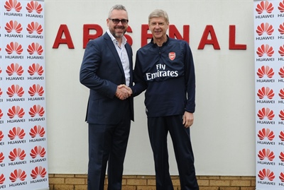 Arsenal manager Arsène Wenger with Mark Mitchinson of Huawei
